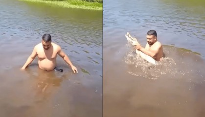 哥伦比亚一男子戏水时突然抱到鳄鱼,吓得急忙逃到船上